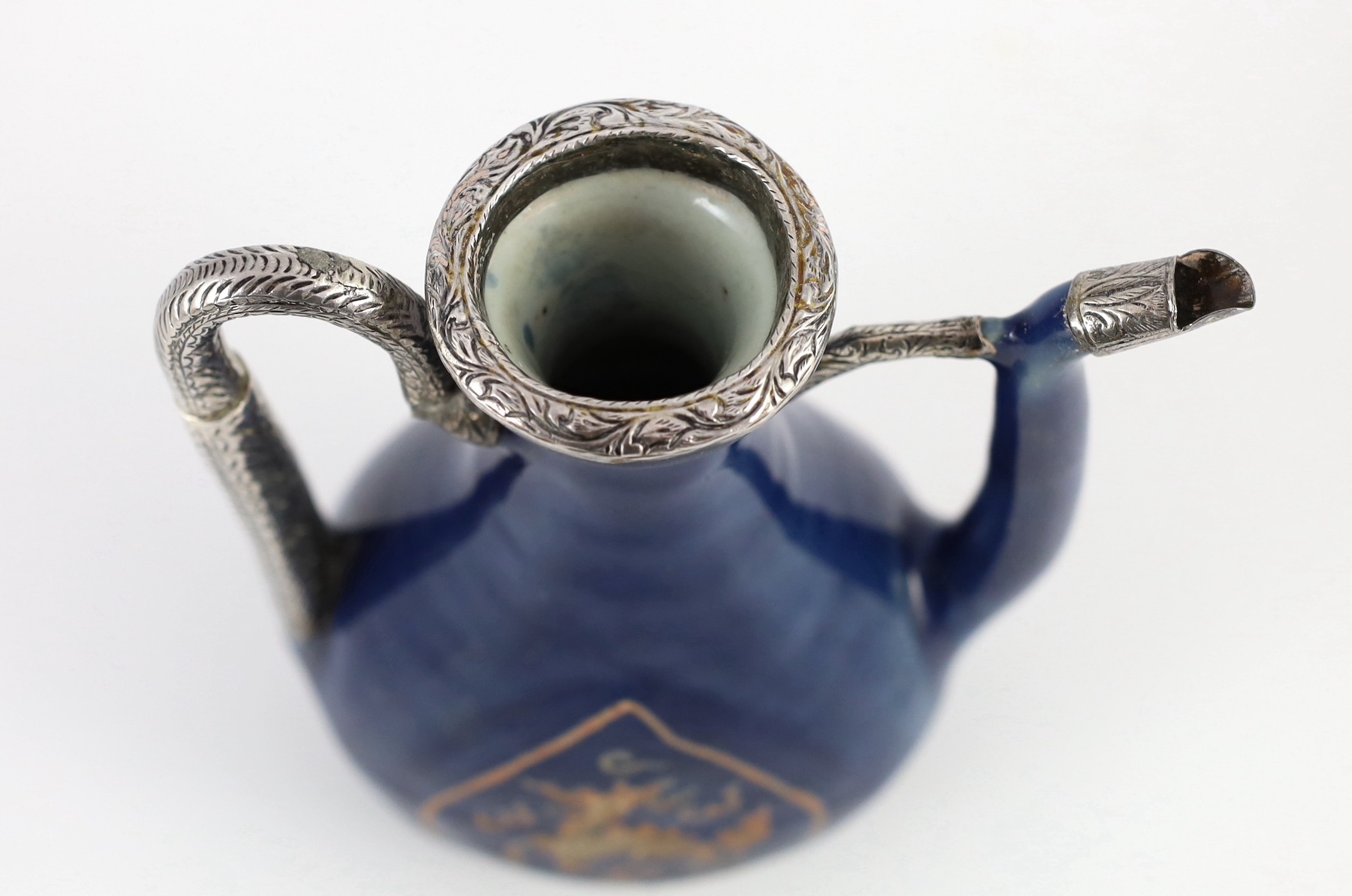 A Chinese late Ming blue glazed and slip decorated ‘qilin’ ewer, for the Islamic market, 20cm high, later Islamic silver mounts, wear